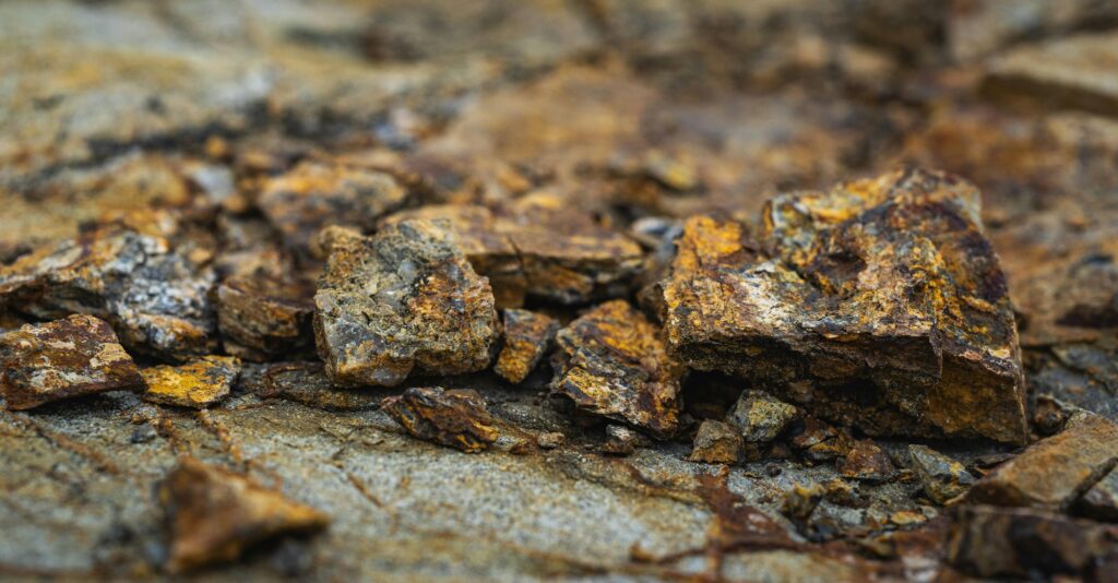 Detailed close-up of weathered and eroded rocks showcasing rich rusty textures.